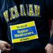 A bib is pinned to a University of Michigan sweatshirt on Saturday, April 20. AnnArbor.com I Daniel Brenner